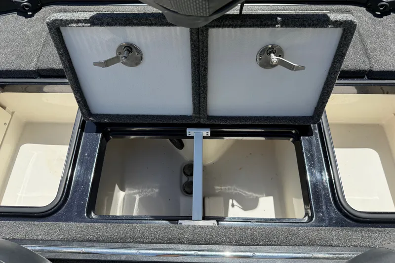 Slide: The Image of Open storage compartments on a 2020 Ranger Z518 boat, showcasing interior space and design. - 50