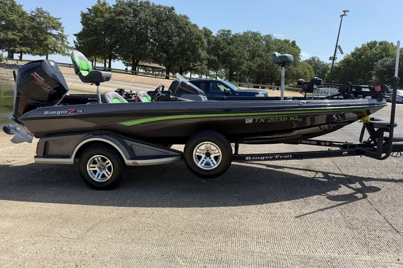 Slide: The Image of 2020 Ranger Z518 boat on trailer at a lakeside ramp, ready for launch. - 18