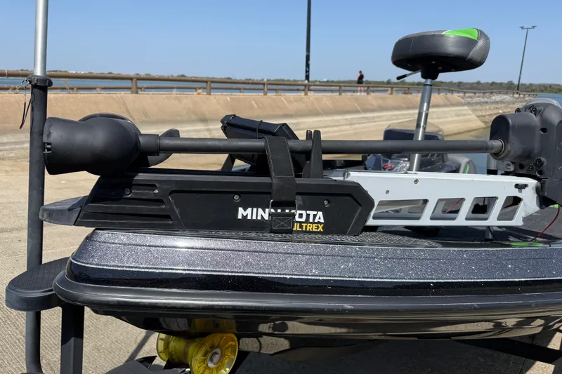 Slide: The Image of 2020 Ranger Z518 boat with Minn Kota Ultrex trolling motor, docked by a concrete ramp. - 28