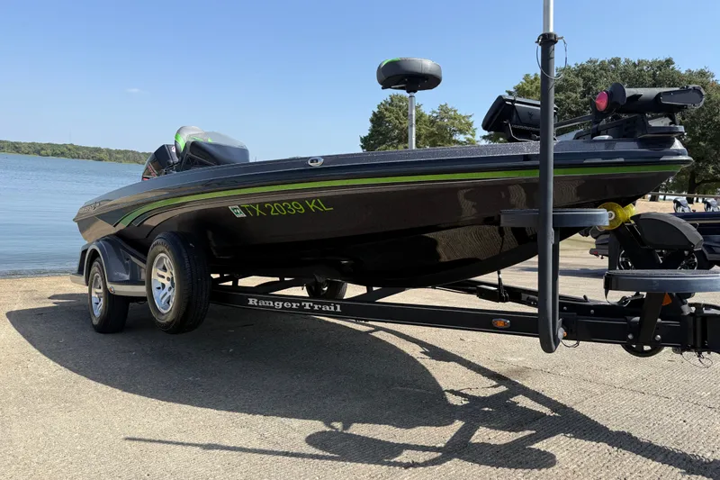 Slide: The Image of 2020 Ranger Z518 boat on trailer by a lake, ready for launch. - 15