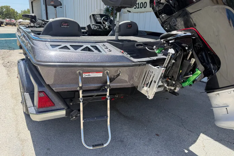 Slide: The Image of 2020 Ranger Z518 boat with motor and ladder, parked on a trailer. - 36
