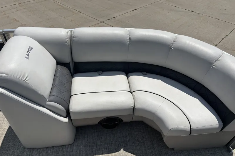 Slide: The Image of 2020 Lund LX220 Pontoon boat seating with gray upholstery. - 7