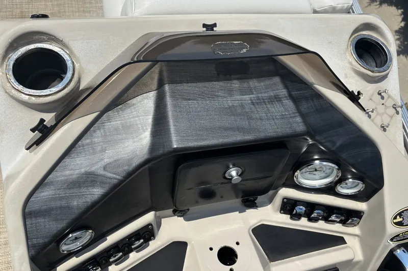 Slide: The Image of Dashboard of a 2020 Lund LX220 Pontoon boat with gauges and controls. - 10