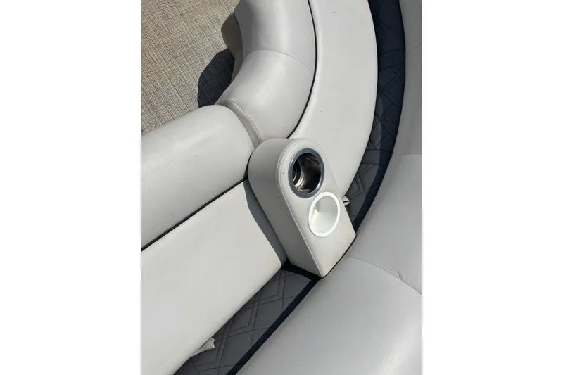 Slide: The Image of 2020 Lund LX220 Pontoon boat seating with integrated cup holders. - 14