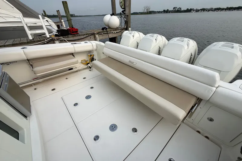 Slide: The Image of 2016 Boston Whaler 420 Outrage boat with spacious deck and multiple outboard engines. - 26
