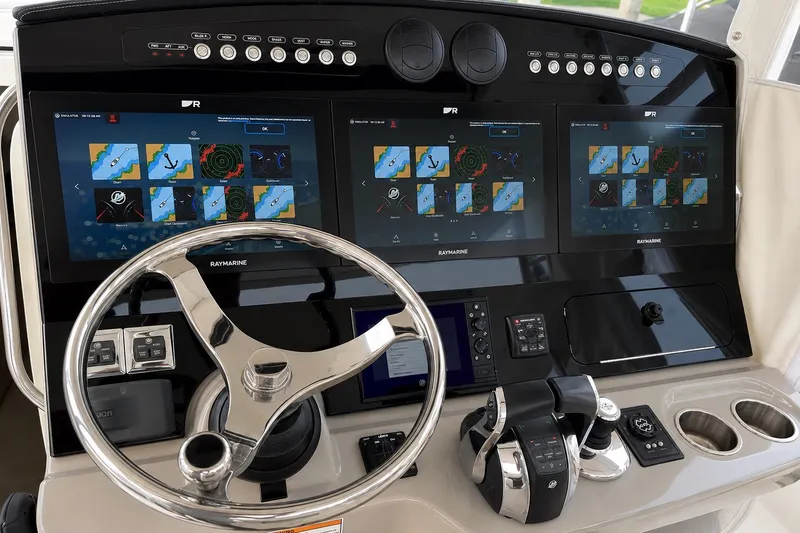 Slide: The Image of Control panel of a 2016 Boston Whaler 420 Outrage with advanced navigation displays. - 6