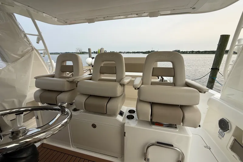 Slide: The Image of Boston Whaler 420 Outrage 2016 helm seats with ocean view in background. - 25