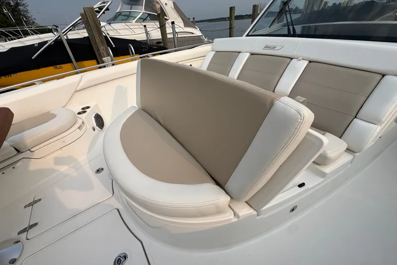 Slide: The Image of 2016 Boston Whaler 420 Outrage boat interior with beige and white seating. - 19
