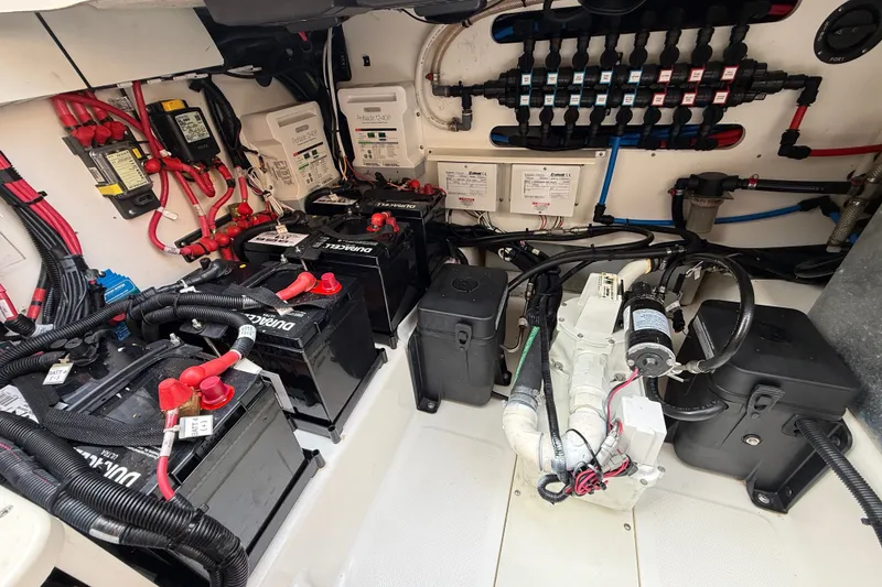 Slide: The Image of Electrical system of a 2016 Boston Whaler 420 Outrage boat, featuring batteries and wiring. - 57
