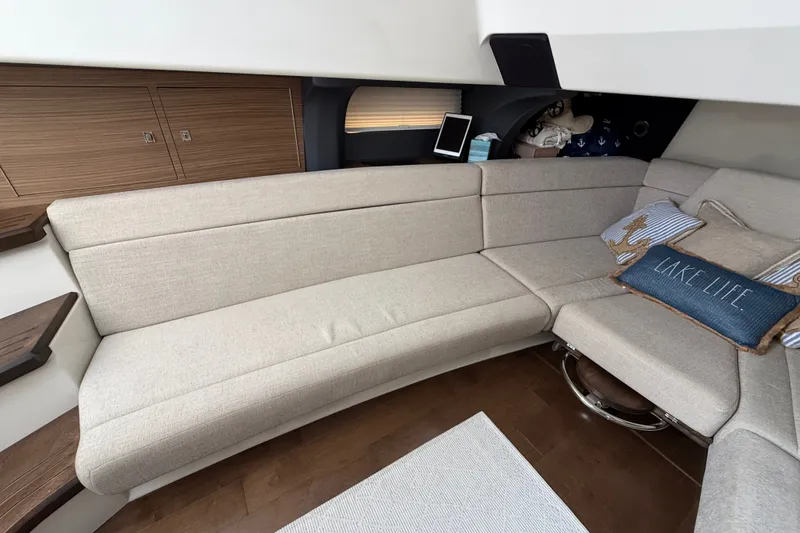 Slide: The Image of Interior of 2016 Boston Whaler 420 Outrage with beige seating and nautical decor. - 39