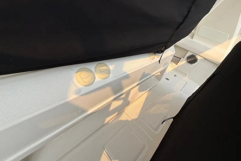 Slide: The Image of Interior view of a 2016 Boston Whaler 420 Outrage boat, featuring sleek design elements. - 51
