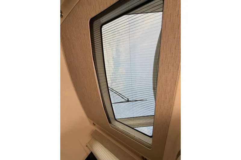 Slide: The Image of Skylight view from 2016 Boston Whaler 420 Outrage, showcasing sleek interior design. - 33