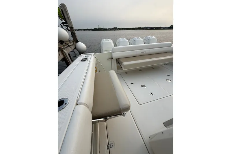 Slide: The Image of 2016 Boston Whaler 420 Outrage boat interior with seating and outboard motors. - 28