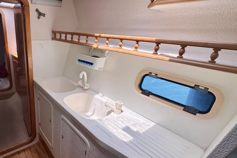Slide: The Image of Interior of 2000 St Francis 44 yacht with dual sinks and porthole window. - 26