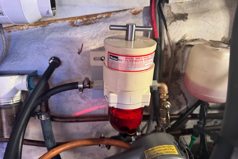 Slide: The Image of Diesel fuel filter system in a 2000 St Francis 44 boat engine compartment. - 39