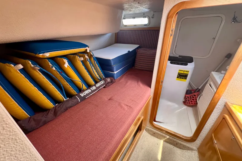 Slide: The Image of Cozy cabin interior of 2000 St Francis 44 yacht with cushions and compact amenities. - 29