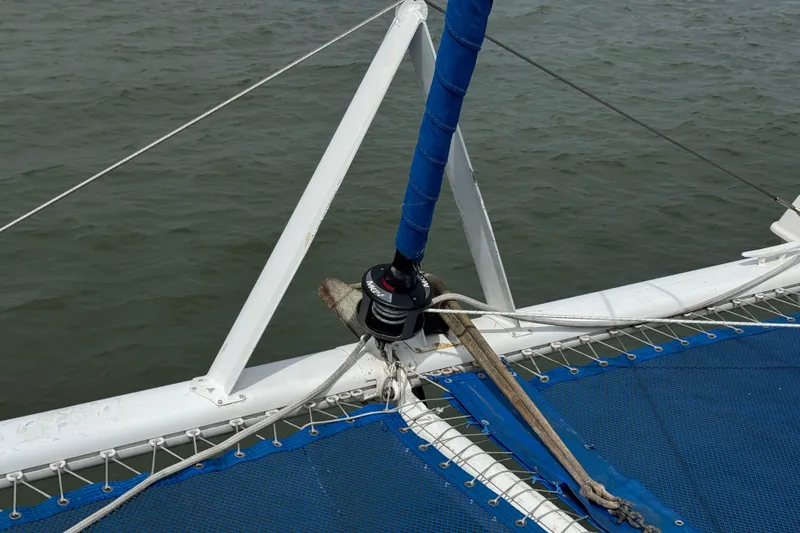 Slide: The Image of Bow of a 2000 St Francis 44 catamaran with blue netting and rigging details. - 51