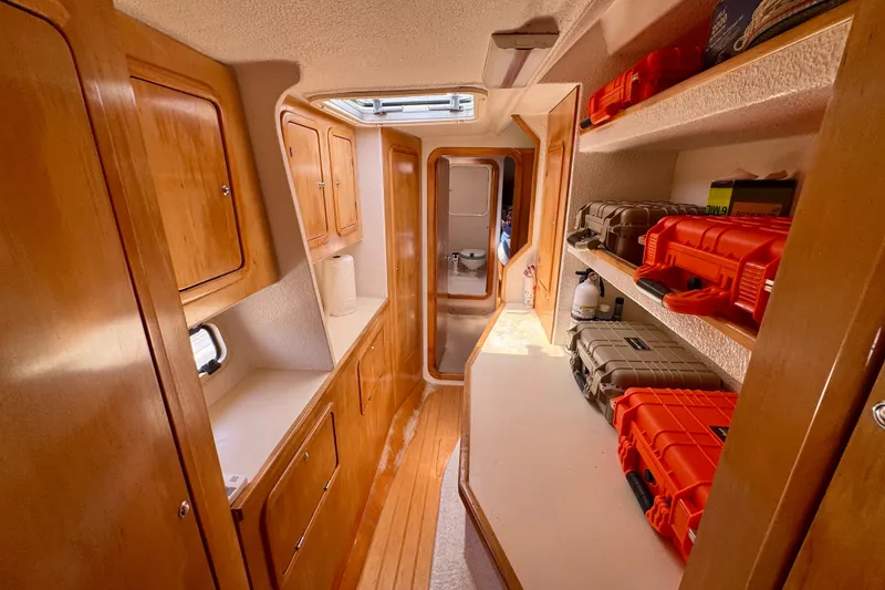 Slide: The Image of Interior of 2000 St Francis 44 yacht with wooden cabinets and storage shelves. - 42