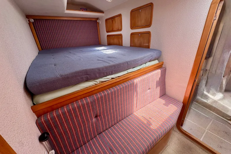 Slide: The Image of Cozy cabin interior of 2000 St Francis 44 yacht with bed and seating area. - 32