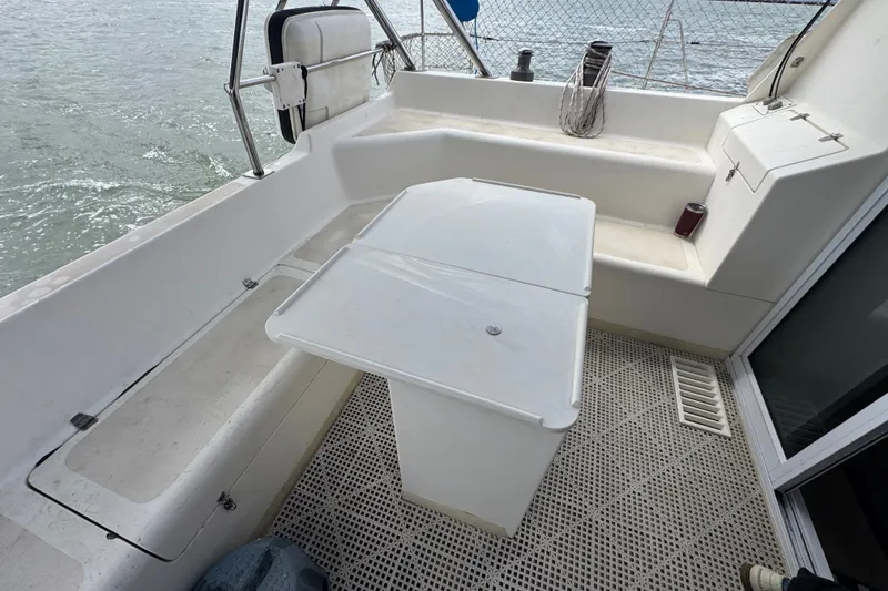 Slide: The Image of Cockpit of 2000 St Francis 44 yacht with seating and table, overlooking water. - 49