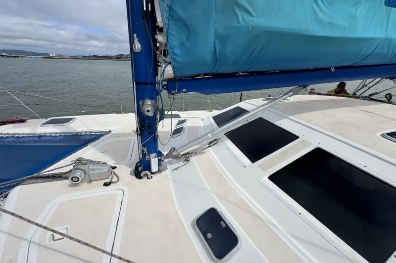 Slide: The Image of Sailing catamaran St Francis 44, 2000 model, with blue sail cover on deck. - 55