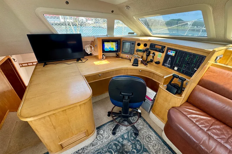 Slide: The Image of Navigation station of a 2000 St Francis 44 yacht with modern equipment and seating. - 13