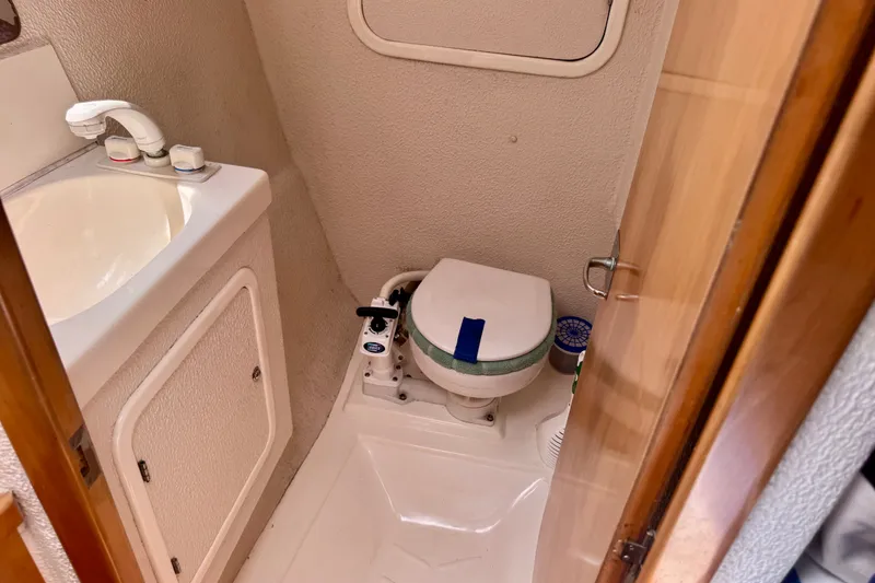 Slide: The Image of Compact bathroom in 2000 St Francis 44 yacht with sink and marine toilet. - 43