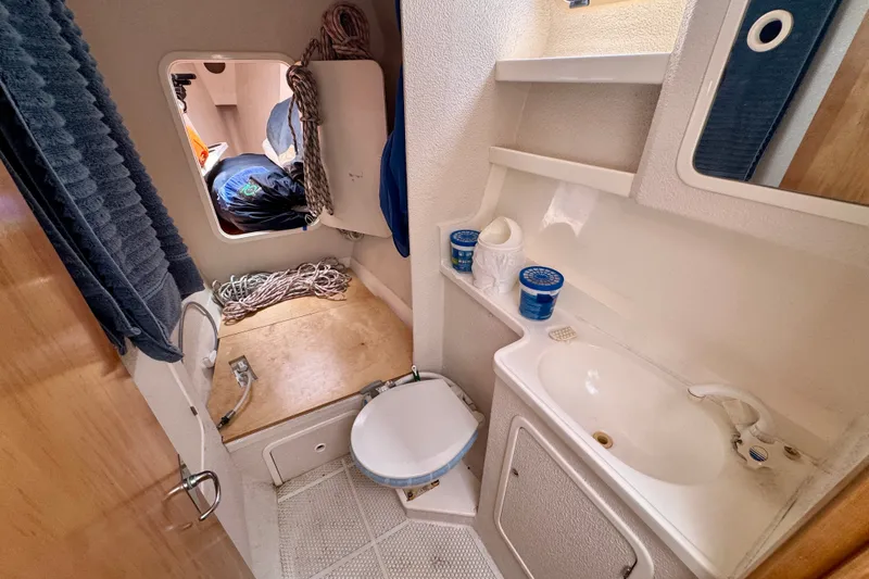 Slide: The Image of Small bathroom on a 2000 St Francis 44 yacht, featuring a sink and toilet. - 33