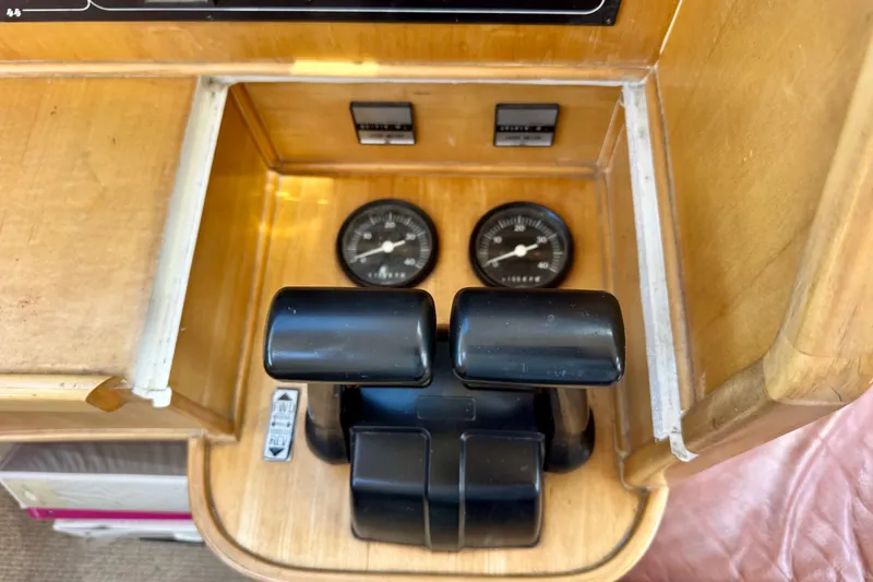 Slide: The Image of Control panel of a 2000 St Francis 44 boat with gauges and levers. - 9