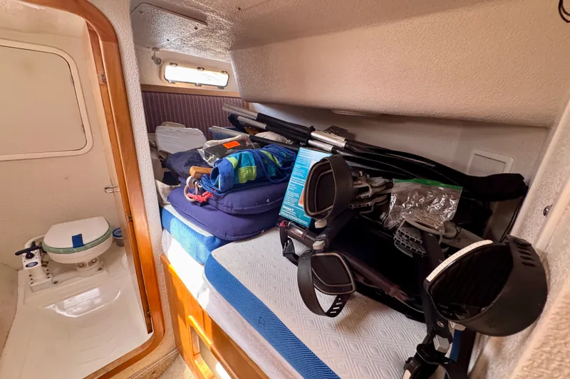 Slide: The Image of Interior of a 2000 St Francis 44 yacht cabin with gear and equipment. - 44