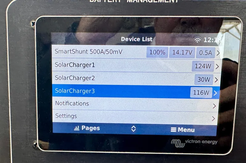 Slide: The Image of Battery management screen displaying solar charger status and power output on a St Francis 44, 2000 model. - 57