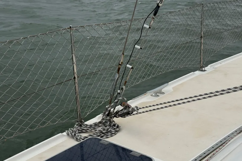 Slide: The Image of Deck of 2000 St Francis 44 sailboat with safety netting and rigging details. - 56