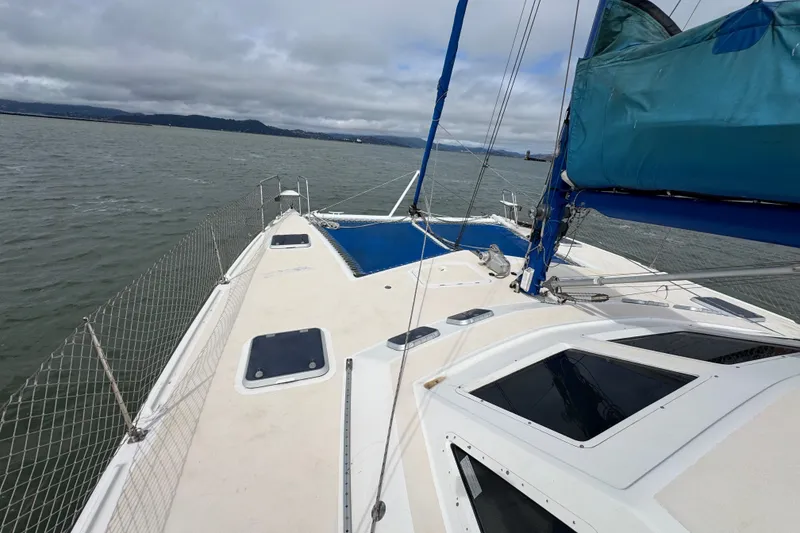 Slide: The Image of Sailing on a 2000 St Francis 44 catamaran with blue sails on a cloudy day. - 52