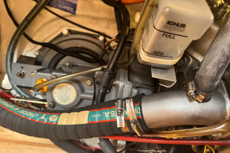 Slide: The Image of Engine compartment of a 2000 St Francis 44 with Kohler components and hoses. - 38