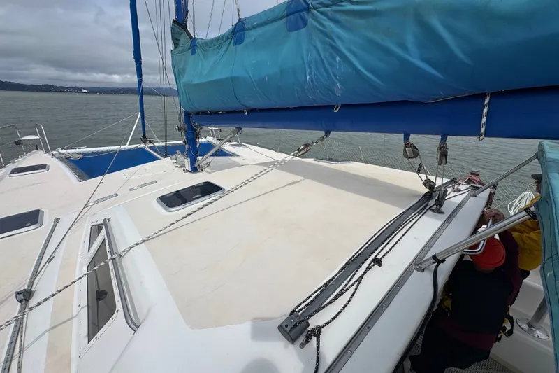 Slide: The Image of Sailing catamaran St Francis 44, 2000 model, with blue sail cover on calm waters. - 53