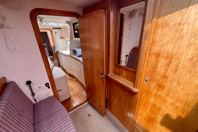 Slide: The Image of Interior of 2000 St Francis 44 yacht with wooden finishes and compact kitchen area. - 21