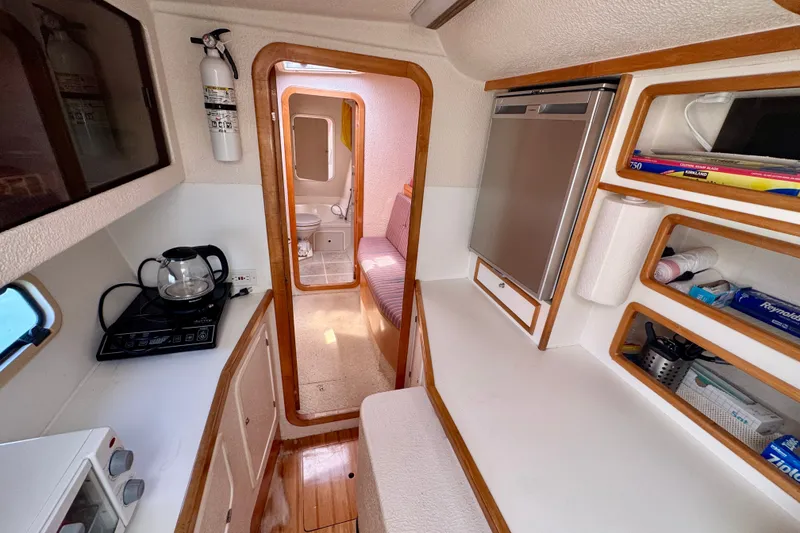 Slide: The Image of Interior of 2000 St Francis 44 yacht with kitchenette and compact storage. - 24