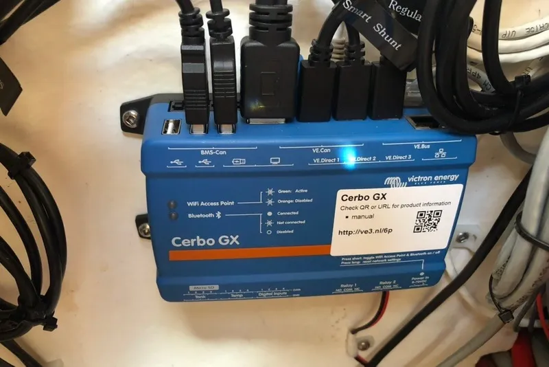 Slide: The Image of Victron Energy Cerbo GX device with multiple cables connected, featuring WiFi and Bluetooth capabilities. - 40