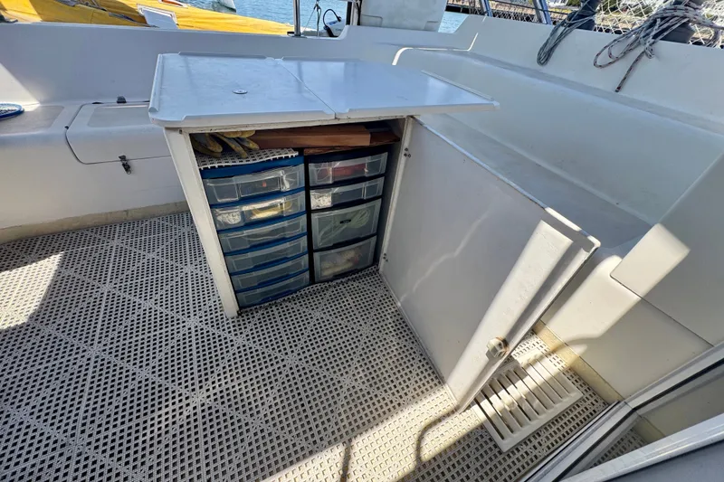 Slide: The Image of Storage compartment with drawers on a 2000 St Francis 44 boat deck. - 45
