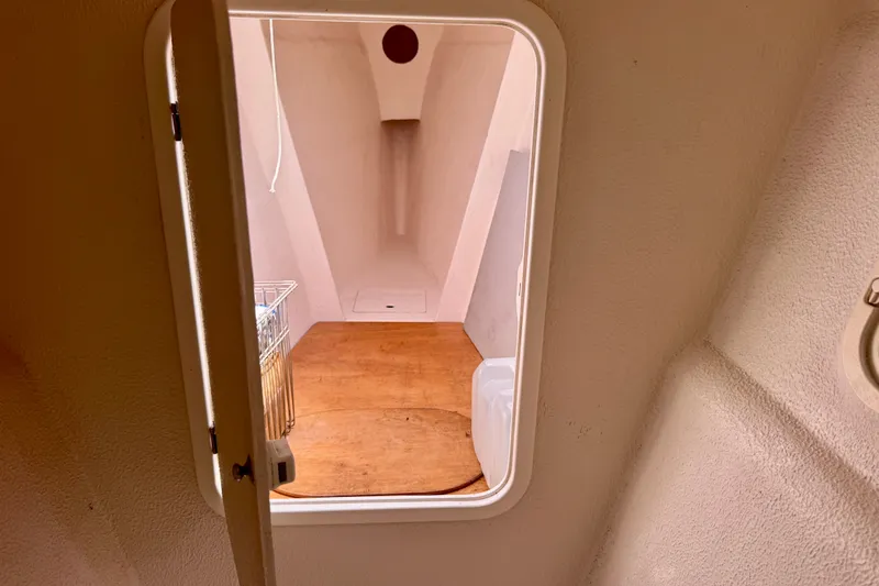 Slide: The Image of Interior view of a 2000 St Francis 44 sailboat cabin with wooden flooring. - 17