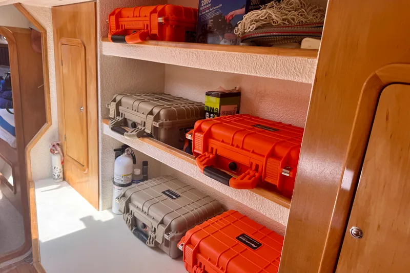 Slide: The Image of Storage shelves on a 2000 St Francis 44 yacht with protective cases and equipment. - 40