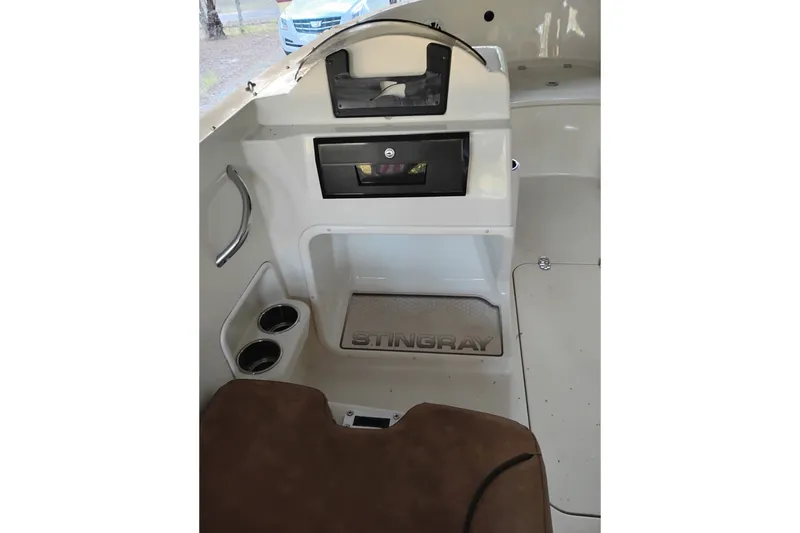 Slide: The Image of Interior of 2021 Stingray 172 SC boat with dashboard and cup holders. - 5