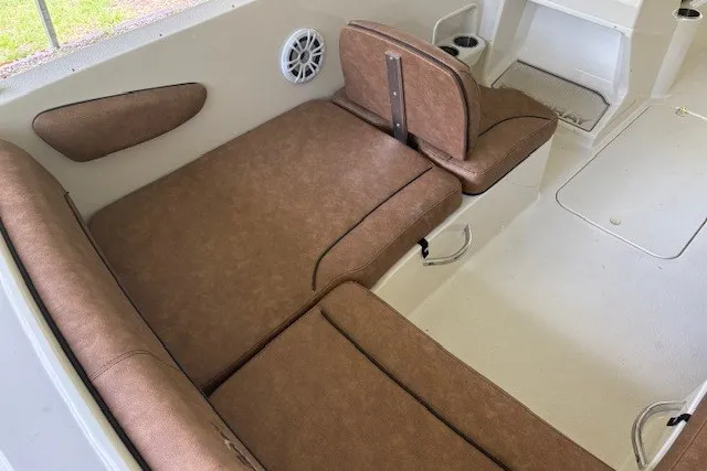 Slide: The Image of 2021 Stingray 172 SC boat interior with brown seating and speaker. - 22