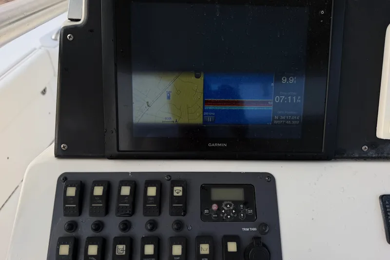 Slide: The Image of Garmin navigation display and control panel on 2013 Robalo R260 Center Console boat. - 22