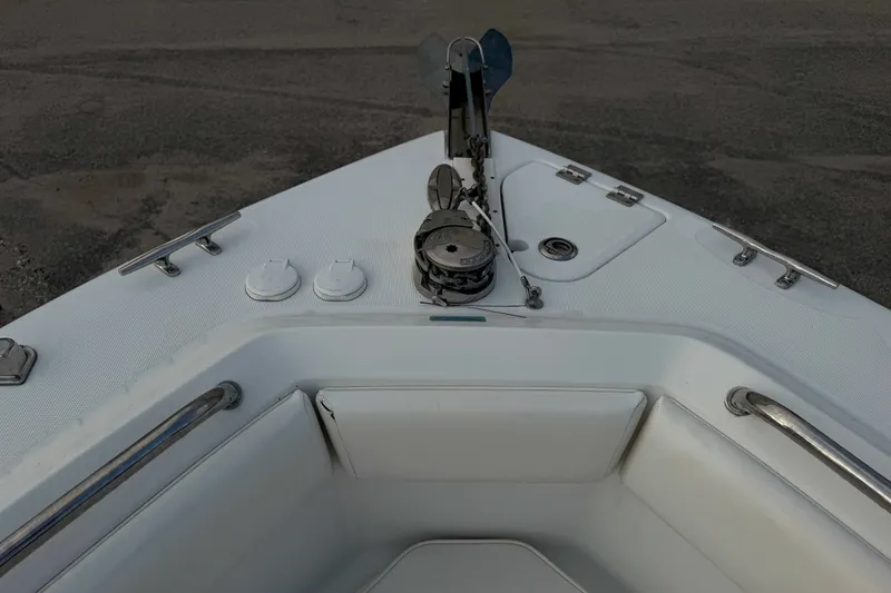 Slide: The Image of 2013 Robalo R260 Center Console boat bow with anchor and seating area. - 16