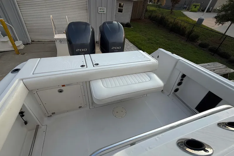 Slide: The Image of 2013 Robalo R260 Center Console boat with twin 200 engines, featuring spacious seating. - 26