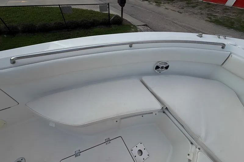 Slide: The Image of 2013 Robalo R260 Center Console boat interior with cushioned seating and speaker. - 17