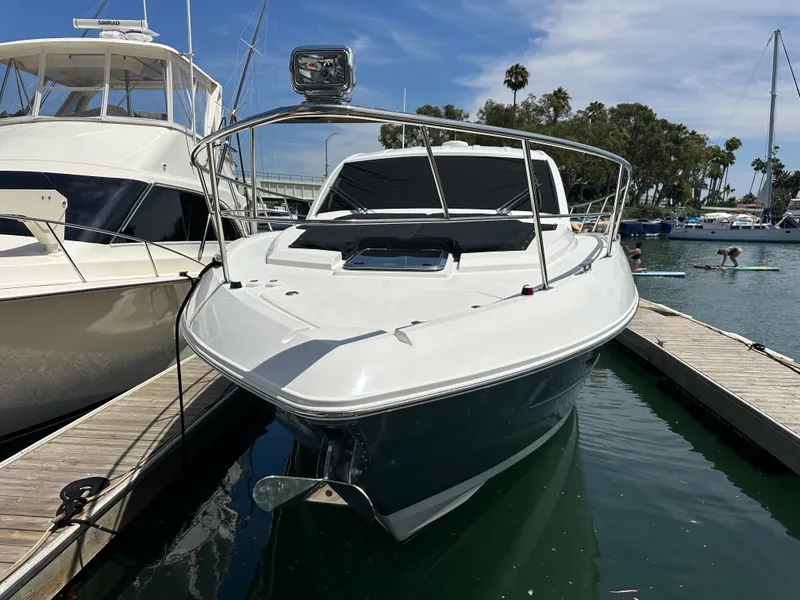 Slide: The Image of A 2018 Cruisers Yachts 390 Express Coupe docked. It features a sleek, modern design. - 3