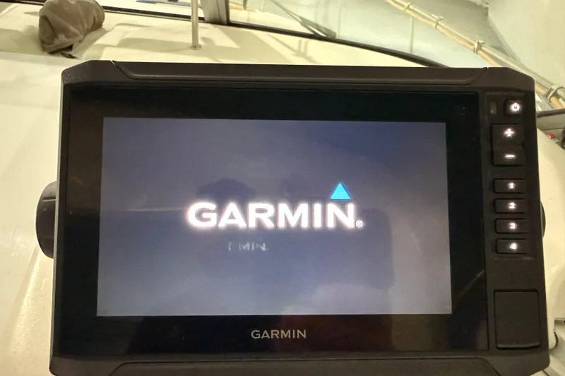 Slide: The Image of Garmin navigation system on 1998 Sea Ray 290 Sundancer boat dashboard. - 13