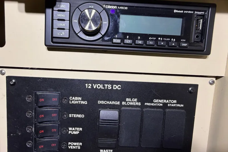 Slide: The Image of Control panel of a 1998 Sea Ray 290 Sundancer with Clarion M508 stereo system. - 24